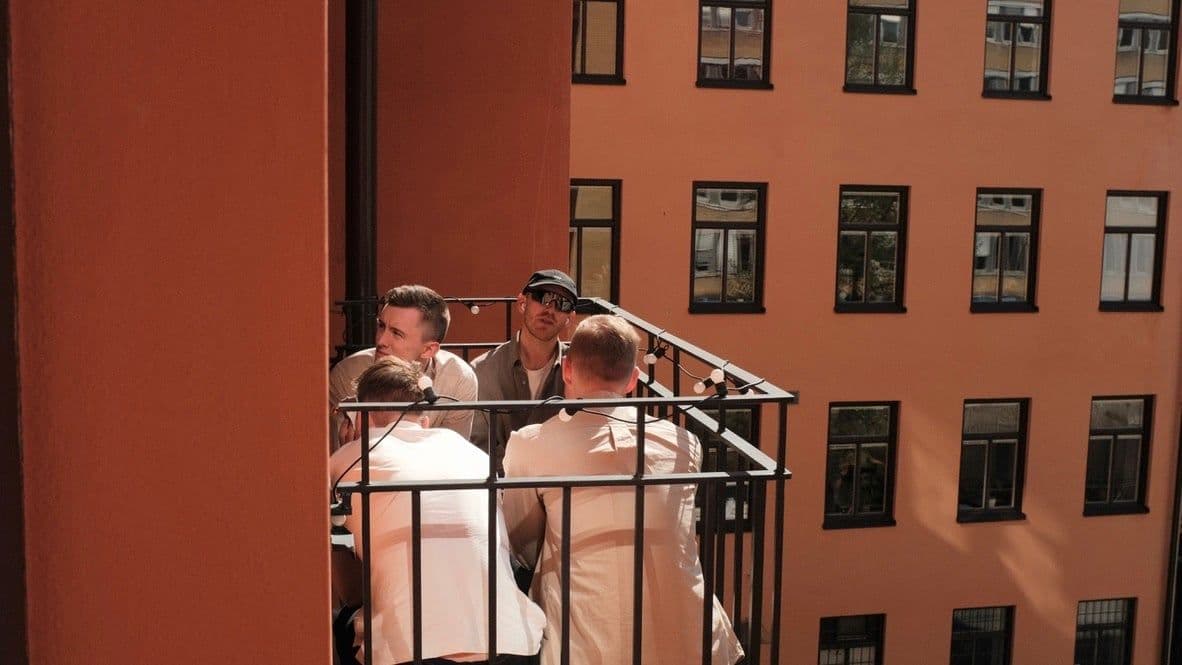 The team on the courtyard balcony at the Stockholm office